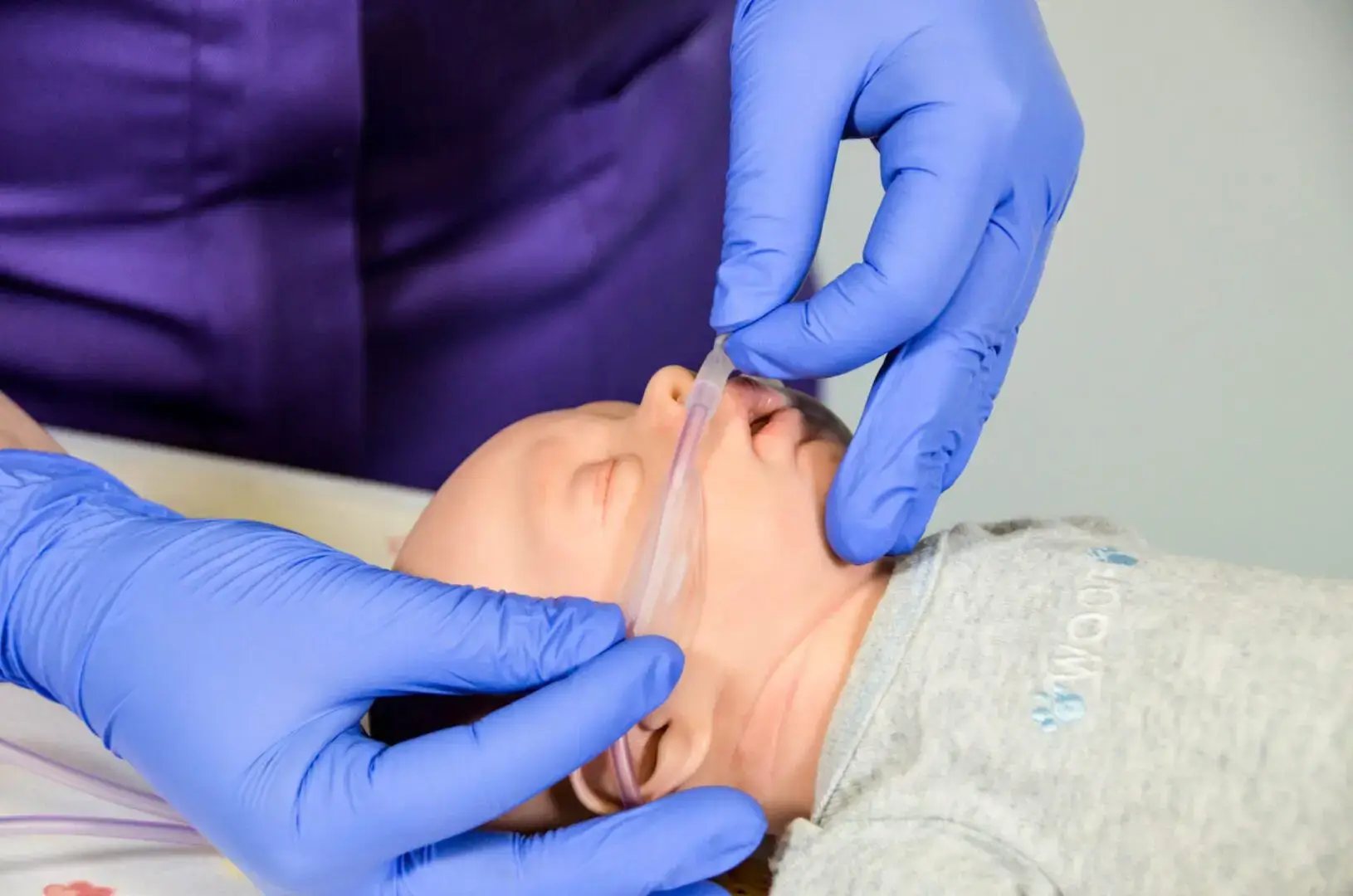 Image of a model baby connected to a Armstrong Medical nasal cannula